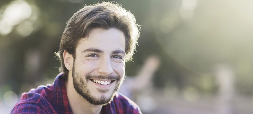 happy man enlarging his penis with a nozzle